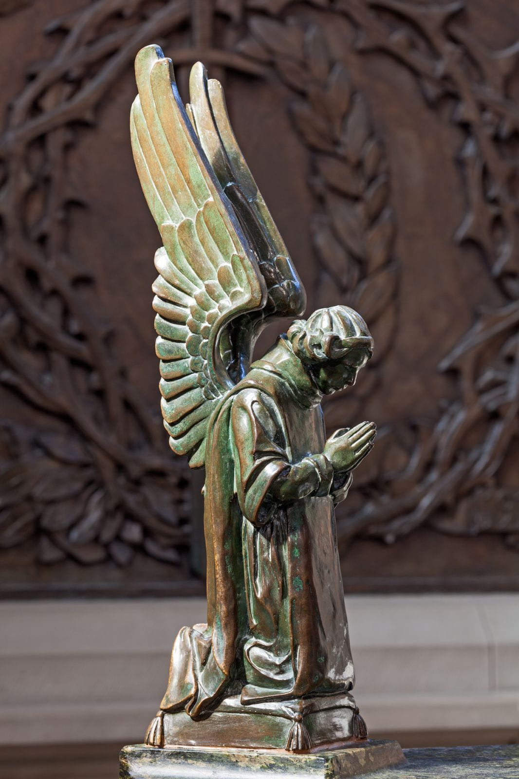 Angel in bronze by Casket in Shrine - Alice Meredith Williams