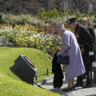 The Queen unveils a plaque to commemorate her opening a new Memorial Garden<br/><a href="gallery/royal-visit-3-july-14/110/add/#comments">Add comment</a>